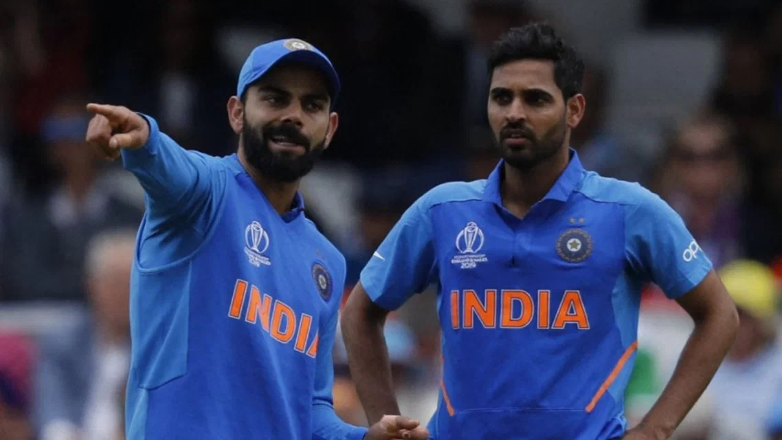 Bhuvneshwar Kumar with Virat Kohli during CWC 2019. Credits - AFP