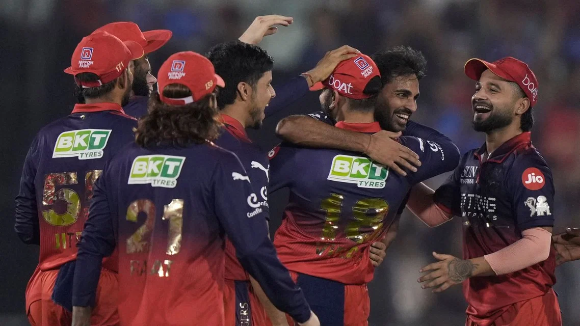 RCB player celebrating a wicket by Bhuvneshwar Kumar. Credits- AP