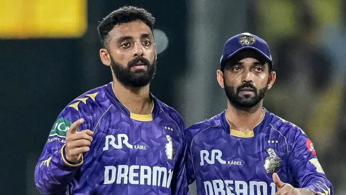 Varun Chakaravarthy with KKR captain Ajinkya Rahane [Source: AFP]