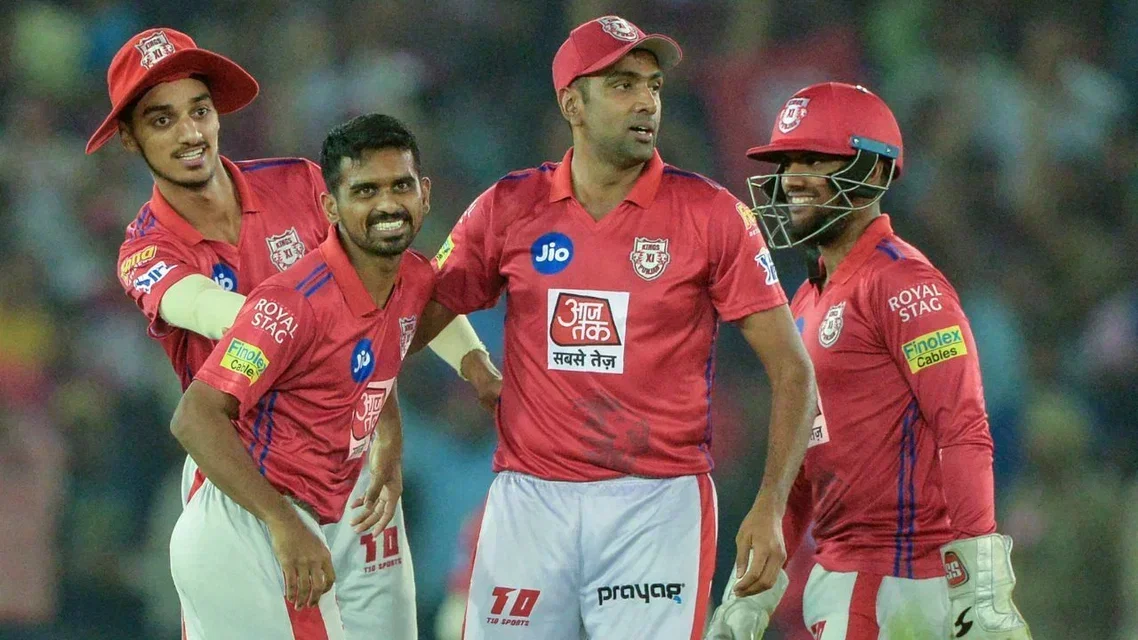 Murugan Ashwin with his Punjab teammates. Image Credits- AFP