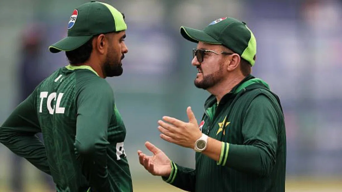 Mike Hesson with Babar Azam. [Sources- AFP]