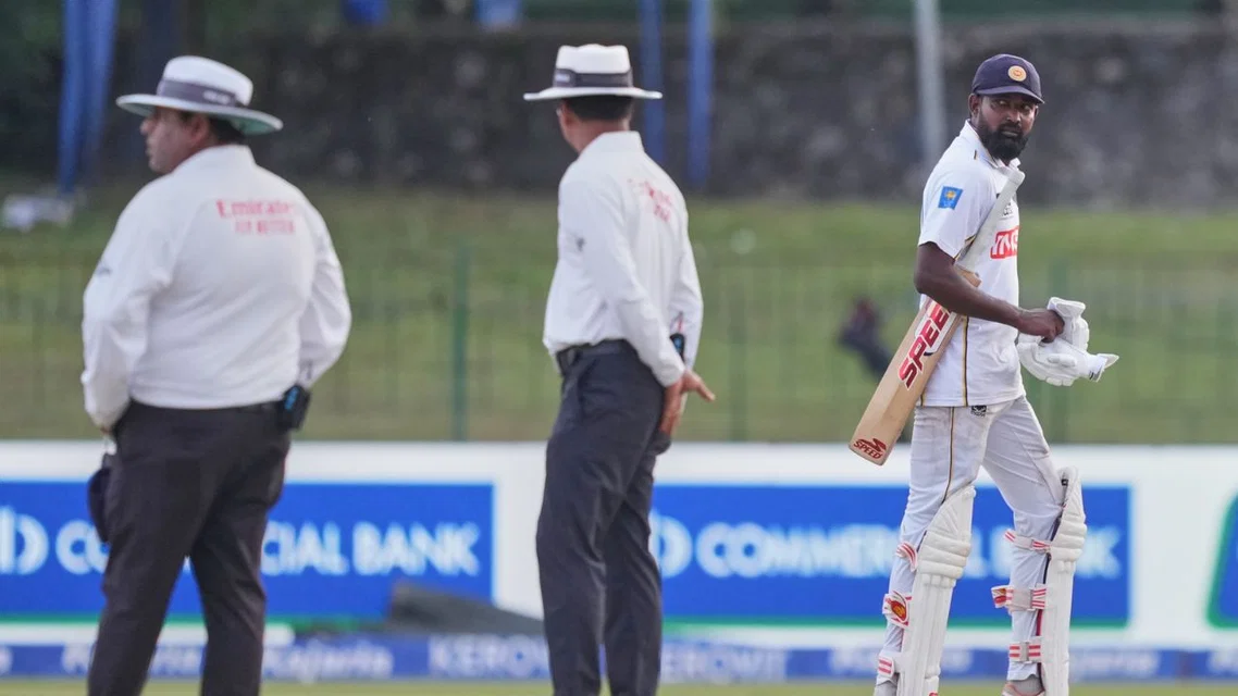 Prabath Jayasuriya looking back at umpires (Source: AP Photos)