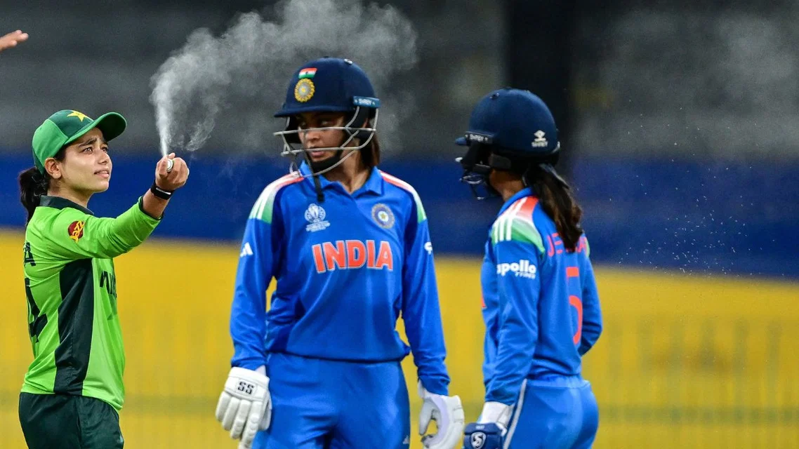 Pakistan's captain Fatima Sana using spray to avoid insects vs India (Source: AFP Photos)