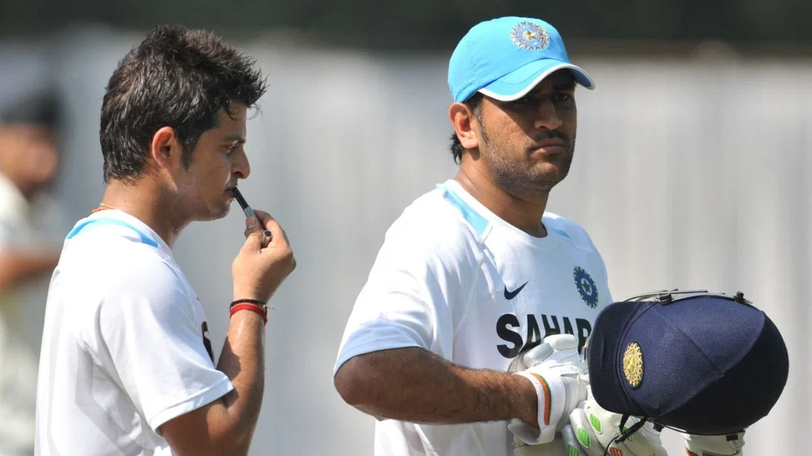 Suresh Raina with MS Dhoni. [Source - AFP]