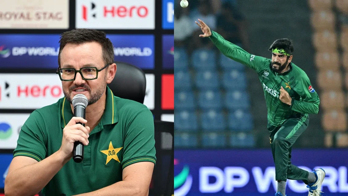 Mike Hesson and Usman Tariq - (Source: AFP)
